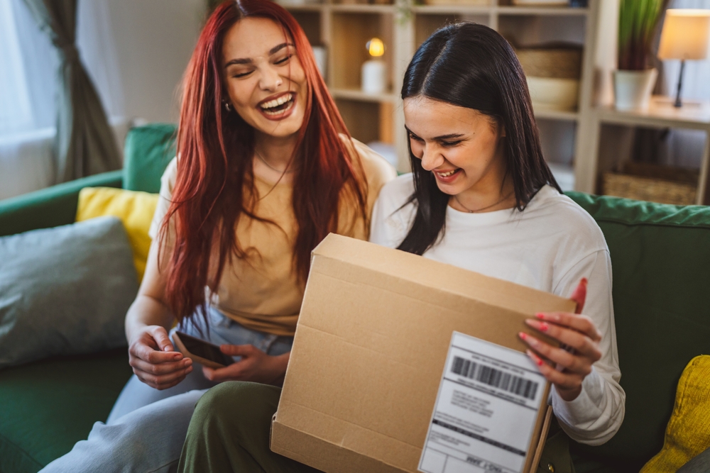 Two,Women,Young,Teenage,Females,At,Home,Open,Post,Package